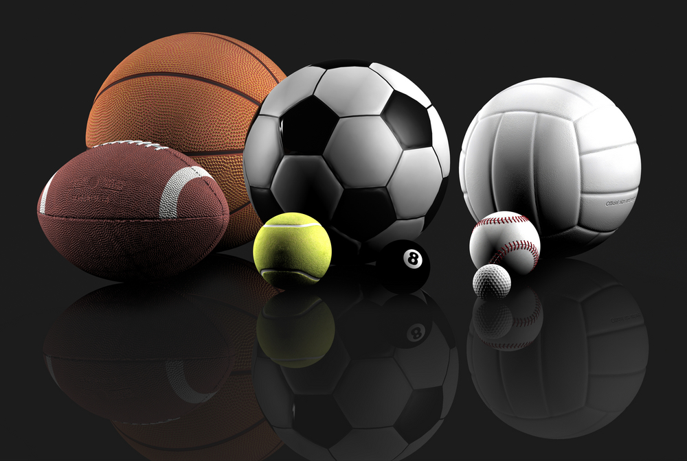 sports balls over a grey background